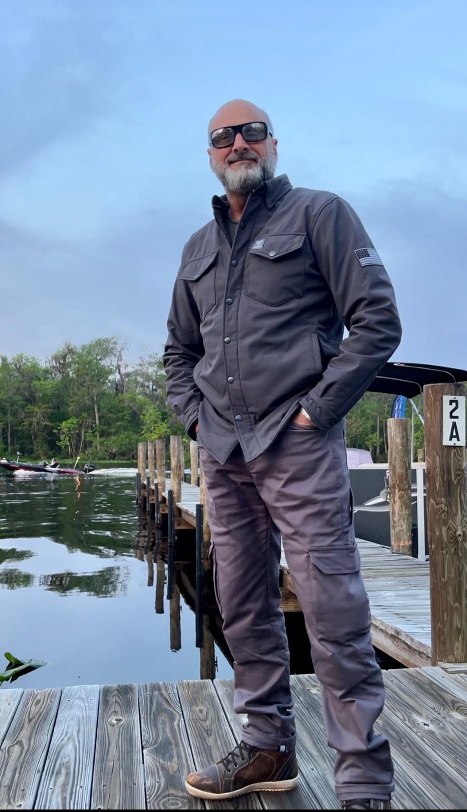 Rider-In-Protective-Jacket-On-Background-Of-Lake