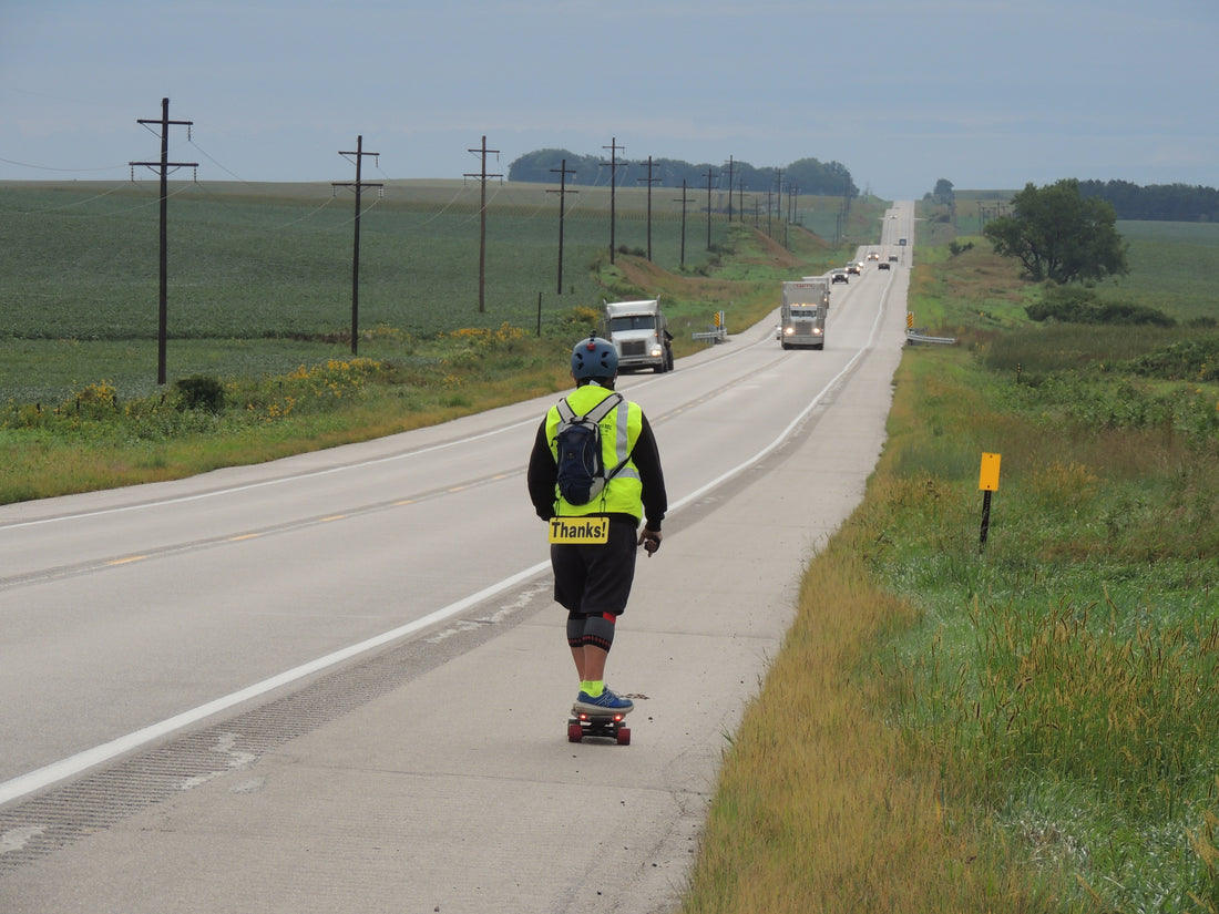 rider-in-the-middle-of-the-highway-goes-to-meet-other-cars