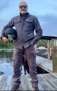 Full-Length-Rider-In-Protective-Jacket-On-Background-Of-Lake