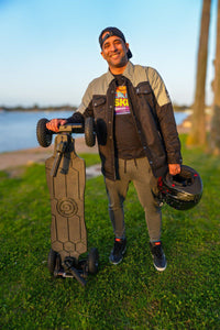 Rider-In-Protective-Shirt-Holds-Helmet-And-Skateboard