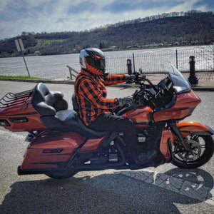 Rider-On-Motorcycle-Wearing-Helmet-And-Orange-Black-Checkered-Shirt