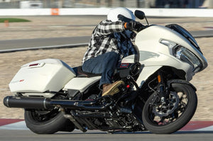 rider-in-checkered-shirt-on-white-motorcycle