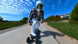 rider-in-helmet-and-checkered-shirt-on-skateboard